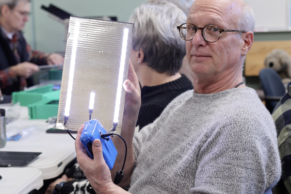 Pastor Tom Murray shows off his solar light kit